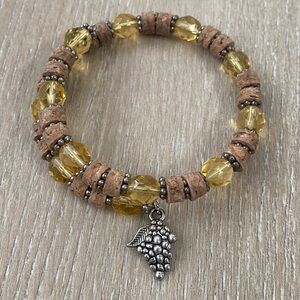 Elegant Yellow and Brown Beaded Bracelet with Silver Charm
